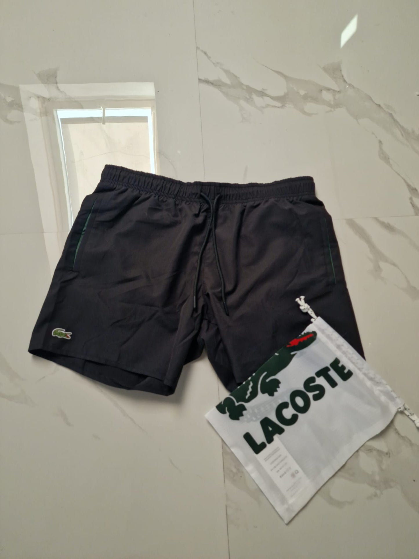 Lacoste kupaci sorc